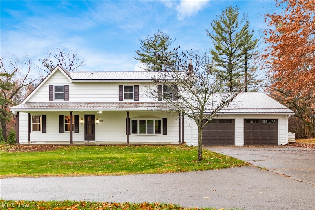 Nestled on 1.73 acres, this stunningly renovated 4-bedroom, 2-bath home offers 2,400 sq. ft. of beautifully finished living space designed for both comfort and style. Step into the grand foyer, complete with a custom built-in bench—perfect for keeping everyday essentials neat and organized. The main level is made for living and entertaining: a spacious living room with new Beasley hardwood flooring throughout, a formal dining room for unforgettable gatherings, and a large family room with plush carpet that invites cozy movie nights or lively celebrations. The showpiece kitchen is a chef’s dream, featuring custom cabinetry by Sealock Woodworking, quartz countertops, a stainless-steel farm sink, and brand-new stainless-steel appliances. A convenient main-floor bedroom and updated full bath add flexibility for guests or multi-generational living. Upstairs, the luxurious primary suite feels like a private retreat, complete with a spa-inspired bath boasting a double-sink vanity, walk-in shower, and elegant ceramic tile flooring. Two additional bedrooms and dual staircases add character and convenience. Outdoor living is just as impressive: enjoy morning coffee on the sprawling covered front porch, host summer barbecues on the tiered back deck, or explore the expansive yard with storage shed. The attached garage easily accommodates two or more vehicles, and the metal roof (2020) provides lasting peace of mind. With extensive renovations throughout, this home blends timeless charm with modern upgrades—turnkey, full of character, and ready for its next owner to fall in love.