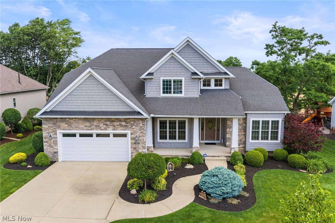 Welcome to this custom-built Colonial in The Grove of Weatherstone in Wadsworth, thoughtfully designed with a sought-after first-floor master suite and timeless craftsmanship throughout. Built in 2008 by KNL Custom Homes, this 2,844-square-foot home showcases the kind of rich woodwork and architectural detail that is rarely found today. The kitchen features custom Birch cabinets and stainless steel appliances, blending style and function for everyday living. The dramatic two-story great room features a gas fireplace and stunning arched floor-to-ceiling windows that fill the space with natural light. The first-floor master suite offers a private retreat with a bath featuring a custom shower, double vanity, walk-in closets, and a separate water closet. Upstairs, you'll find generously sized bedrooms offering comfort and flexibility for family or guests. An unfinished basement already plumbed for a full bath provides excellent potential for future living space. Outside, beautiful landscaping surrounds the home, while the screened-in porch offers a wonderful view of the backyard,perfect for relaxing or entertaining.