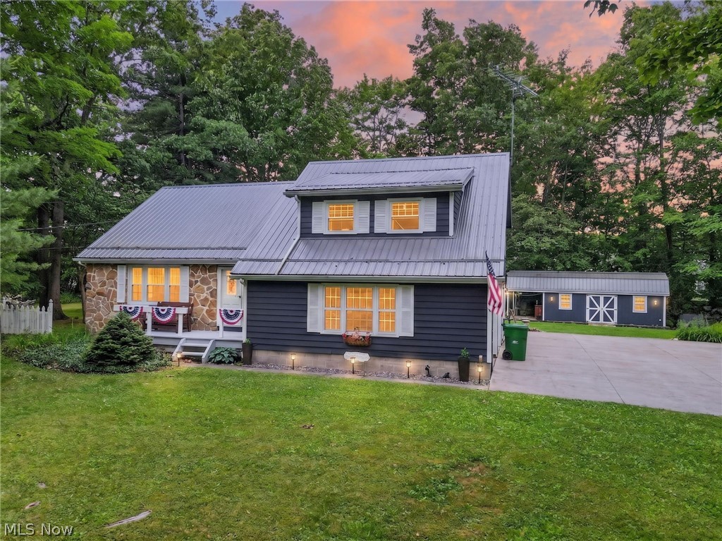 Meticulously maintained and move-in ready, this spacious 4-bedroom, 2.5-bath home is located in the heart of Middlefield. A welcoming foyer with beautiful hickory flooring leads to the formal living room, dining room, and remodeled eat-in kitchen featuring ample cabinetry and sliders that open to the multi-tiered deck. The cozy family room offers a wood-burning fireplace, indoor grill, and convenient half bath, creating the perfect space for entertaining and everyday living. The second level features three generously sized bedrooms with hardwood flooring and a full bathroom. Just a few steps above, the private fourth bedroom is currently being used as the primary suite and includes its own full bath.The insulated lower level provides abundant storage space and utility options. The home is wired with a 220-volt line that extends to the oversized shed. Additional highlights include a heated 2-car attached garage and a beautifully maintained yard showcasing meticulous landscaping and mature plantings.Enjoy peaceful outdoor living on the multi-tiered deck or unwind on the swing beneath the attached lean-to connected to the oversized shed, which features a metal roof, electric service, water, and lighting. The septic system consists of two 1,000-gallon gravity-fed tanks. A one-year home warranty is included for added peace of mind. This well-cared-for property offers comfort, functionality, and exceptional outdoor enjoyment in a desirable Middlefield location.
