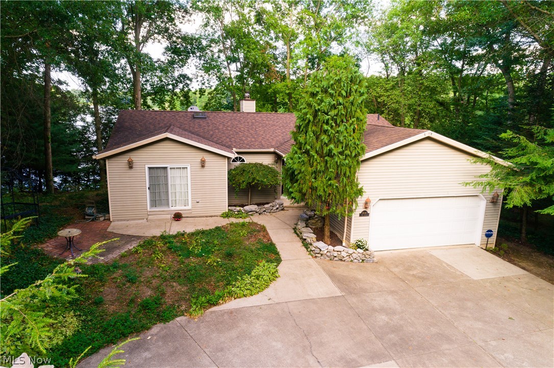 Lakefront ranch with open concept floor plan.  Spectacular views of Lake Lucern sitting on 3 acres.  Extensive decking takes you down to the waters edge with a fishing deck.  Great room with fireplace and cathedral ceiling along with a formal dining area as well as center island eating bar.  Fully finished walkout basement features recreation room with fireplace, office or library with plenty of bookshelves a full bath and bedroom.  Almost 3,000 square feet of finished living space.  A great opportunity for lakefront living.  Call today for your private showing. Go to Youtube and type in the address, check out the video for this property!
