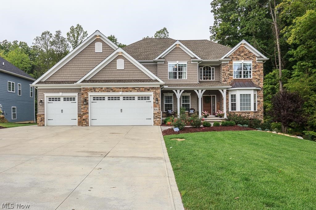This must see, builders private residence, has lots of bells and whistles!  Not your run of the mill home.....Great floor plan, w/1st floor den, formal dining room, 2 story Great Room with nicely crafted embellishments open to the airy eat- in kitchen with white cabinets, beautiful quartz counter tops, hand scraped hardwood flooring, stainless steel appliances and sliding glass door leading to a multi-tiered composite deck and above ground pool with maint. free white vinyl privacy screening! Also on the first floor sits the 5th br which could also be used as play room, 2nd home office, or craft/hobby room! You will love the drop zone with cubbies and laundry room with dog washing station!  The walk-out lower level has both carpeted and LTV areas with cabinets for serving areas at parties that leads to a huge stamped concrete patio, plenty of unfinshed storage area and a full bath! The top level boasts an enormous Master retreat with glamour bath featuring a large soaking tub and fabulous tile walk in shower! In addition,  3 generous sized Br's.  1 that has it's own private bath, 2 that have a jack and jill bath. You cannot duplicate brand new everything this home has to offer for this price! Set your showing appointment TODAY!