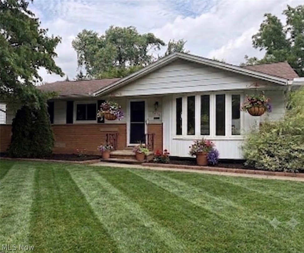 NEW PRICE!  Visit the OPEN HOUSE 12-2 p.m. Saturday 7/25 & Sunday 7/26!  This sweet, well-maintained 3-bedroom, 1.5-bath ranch offers comfortable one-floor living with plenty of space to enjoy. The bright and inviting living room features a beautiful bay window that fills the home with natural light, while the dining area includes sliding glass doors that open to a covered patio—perfect for outdoor dining, entertaining, or simply relaxing while overlooking the backyard and mature trees. The large finished recreation room provides additional living space ideal for a family room, home office, fitness area, or game room. Recent updates offer peace of mind, including a new roof (2018), replacement windows (2016), and an updated bathroom (2026). Situated on a generous quarter-acre lot, the property also includes a 2-car garage and plenty of outdoor space to enjoy. Conveniently located just minutes from Greenbrier Commons, residents have easy access to the community center, library, swimming pool, playground, tennis and volleyball courts, and the Cassidy Theatre. Don't miss this wonderful opportunity to own a move-in-ready ranch in a desirable Parma Heights location!