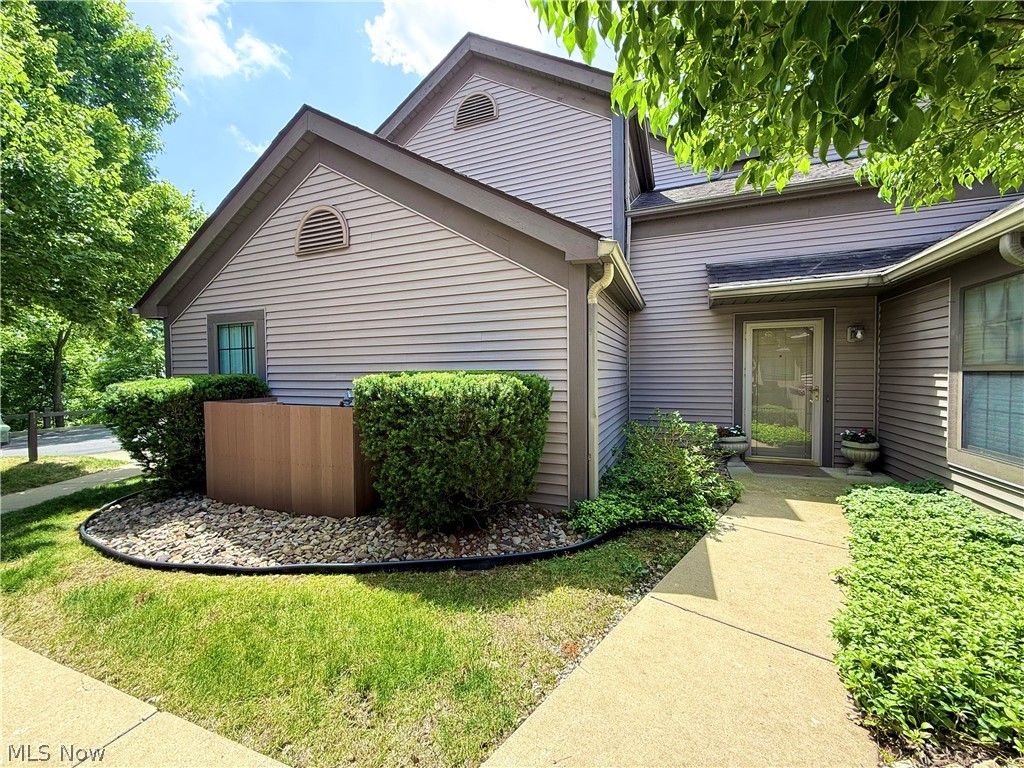 Welcome to this beautifully maintained 2 bedroom, 2 full bath condo located in the desirable Summit at St. Andrews community in Canfield. Designed with the convenience of first-floor living, the main level features both bedrooms, two full baths, the laundry room, kitchen, great room, and access to the private deck, while a spacious loft provides additional flexible living space.
The open floor plan showcases vaulted ceilings throughout, creating an inviting atmosphere filled with natural light. The great room is the heart of the home, featuring a cozy gas fireplace and an open layout that's perfect for relaxing or entertaining. Just off the great room is a bright sunroom/bonus room with vaulted ceilings, skylights, and sliding glass doors leading to the deck an ideal space for a home office, reading room, den, or additional sitting area. The kitchen offers wood cabinetry, ample counter space, and a breakfast bar overlooking the main living area. The primary suite includes a private full bath, while the second bedroom and additional full bath provide comfort and convenience for family or guests. Skylights throughout the home, including the bathrooms and additional living spaces, fill the home with abundant natural light. The loft, complete with a closet, offers endless possibilities as a home office, guest retreat, hobby room, or additional flex space while preserving the convenience of everyday living on the main floor. With its open concept design, vaulted ceilings, gas fireplace, skylights, private deck, and sought after first floor living, this condo offers the perfect blend of comfort, versatility, and low maintenance living in a convenient Canfield location.