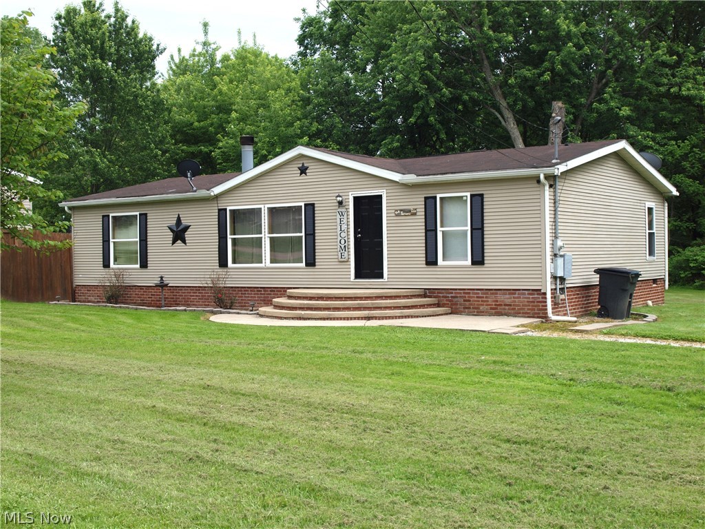Canton South School system!! Canton Township - not Canton City - no taxes! This is a sleeper property with many extras. Flat lot totaling .771 acres. Plenty of space to add buildings or garage. Does have a cement slab with a storage out building. Well-constructed manufactured home on solid band and foundation. Three bedrooms with modern layout - Master on one side of the great room and the other two bedrooms on the oposite side of the house. Full kitchen with large dining area with breakfast bar. Laundry room adjacent with hook ups for electric or gas dryer and washer. Back door out to the backyard entertainment area - space for built in grill, sink, small fridge and large concrete patio. Fire ring also! Private back yard. Don't miss this offering.