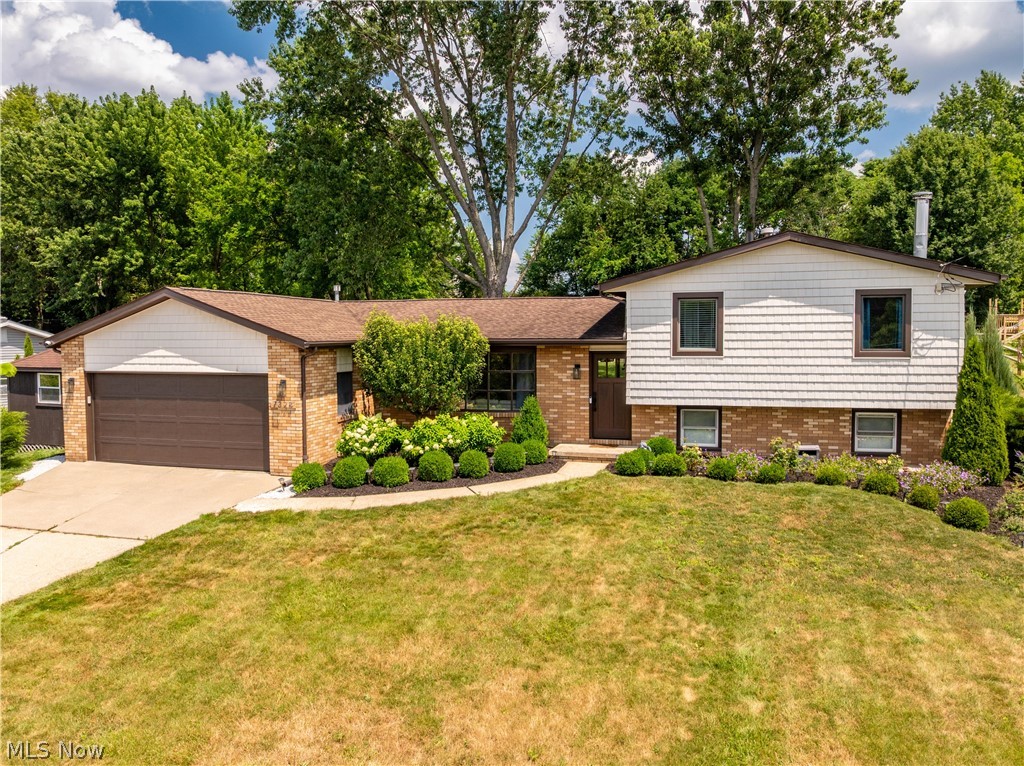 Beautifully updated split-level in the heart of Jackson Township offering over 2,000 square feet, 3 bedrooms, 2 full baths and a private fenced backyard with a peaceful country feel just minutes from shopping, dining, parks and schools. Thoughtfully updated throughout, this move-in ready home is sure to impress. The welcoming living room features a bay window and shiplap accent wall and flows into the dining area with sliding doors to the beautifully landscaped backyard featuring a paver patio and concrete fire pit. The remodeled kitchen offers abundant cabinetry, quartz countertops, newer appliances and a reverse osmosis water filtration system. It opens to a spacious rec room/bonus room and adjoining sunroom, creating the perfect space for entertaining, relaxing, or a home office. Upstairs you'll find three spacious bedrooms with newer carpet, lighting, ceiling fans, updated woodwork and designer accents. The beautifully remodeled full bath features a custom tile tub/shower, tile flooring, quartz vanity and Kohler sink and toilet. The lower level includes a cozy family room with a whitewashed brick gas fireplace, surround and hearth as well as built-ins; a second full bath with shower and a clean laundry/utility room. Major updates provide peace of mind, including a new furnace (2026), fiberglass front door, garage door and opener, vinyl siding, roof (2017), mini-split A/C in the rec room/bonus room (2022), well pump and pressure tank (2019), many Pella windows, gutter guards, new black aluminum fence, hand-scraped wood flooring throughout most of the first floor, smart thermostat and lighting and a large shed with electric and natural gas. This exceptional home combines style, space, and quality updates in a fantastic Jackson Township location. Don't miss this opportunity!