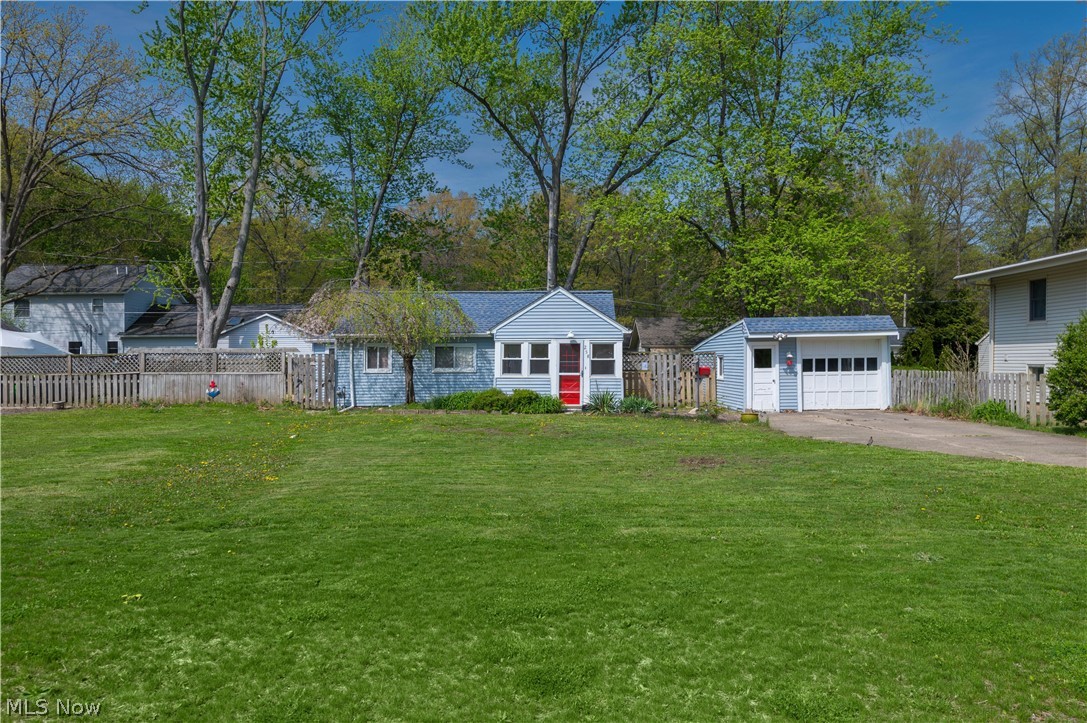 A rare find! Welcome to this charming ranch cottage located at 258 Vineyard in the highly desirable Vineyard Beach neighborhood of Avon Lake—just moments from lake access at Vineyard Beach Park. This prime location offers the best of coastal living, with nearby parks, walking trails, and stunning Lake Erie shoreline just a short walk or bike ride away.

Situated on a spacious double lot, this property stands out with its extra outdoor space—perfect for entertaining, relaxing, or future possibilities.

Step inside through the cozy enclosed front porch into a bright, efficient layout. The living room flows seamlessly into the dining area and beautifully updated kitchen, featuring crisp white cabinetry, modern hardware, granite countertops, and a deep farmhouse sink.

The home offers two comfortable bedrooms and a full bath with clean, modern finishes, making it truly move-in ready.

Outside, enjoy the expansive yard, charming landscaping, and a deck that opens to a private green space—perfect for gatherings, a firepit, or simply unwinding.

Located near Sunset Park, the Avon Lake Public Library, the Aquatic Center, and a variety of local shops and dining options.

Whether you're a first-time buyer, downsizing, or looking for a smart investment, this property offers outstanding value in a sought-after lakeside community.

Don’t miss your chance—schedule your private showing today!