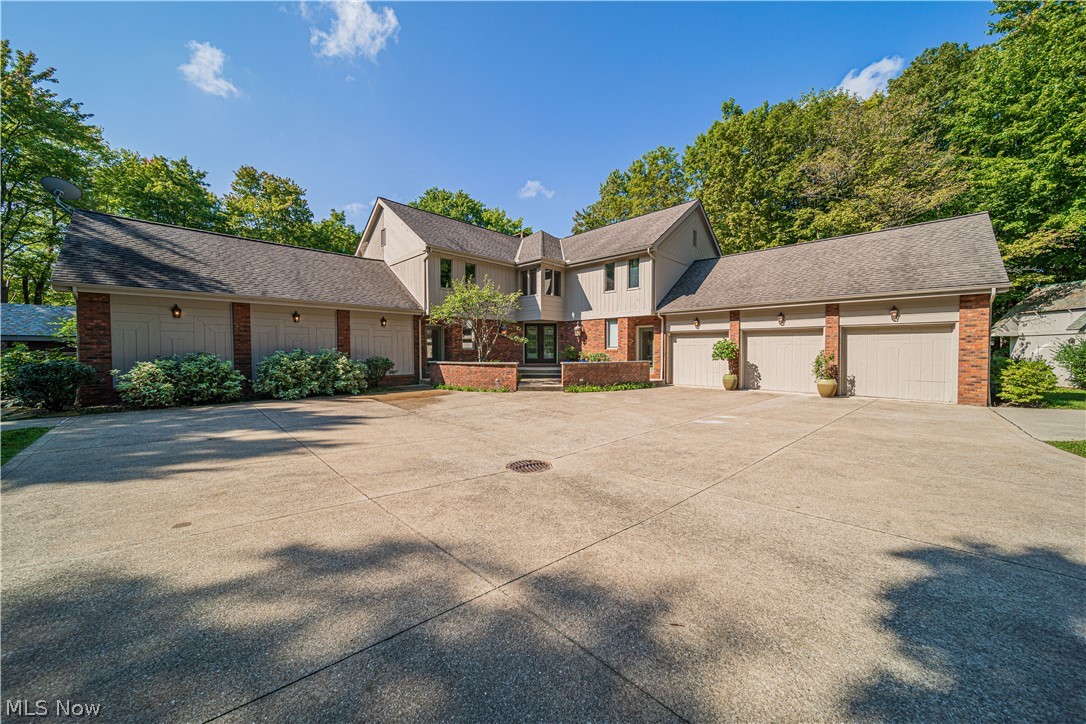 This private oasis has it all! 4000+ sq ft. on 4.39 private, wooded acres with the property ending across a gentle stream. Inside you'll find both living and entertaining space. Convenient entrance off the 3-car garage into a drop zone and full bath. Great room with vaulted ceiling, 2-story stone fireplace and new flooring. Dining/living room off the two story foyer with curved staircase. Private office with coffered ceiling and built-ins. The kitchen offers plenty of workspace with center island, granite counters, gas cook top, double ovens and built-ins. The morning room off the kitchen has a vaulted ceiling, tile floor and walls of windows looking out onto the pool and lush landscape. The extra large, 2-story family room with loft and wet bar has space for everyone. The wall of windows gives views and access to the pool. Upstairs you will find 4 bedrooms and 3 completely remodeled bathrooms. The primary bedroom has 2 closets, fireplace and spa-like bath with double vanity, stand alone tub and large shower. Two bedrooms share a jack & jill bath and closet area between them. 4th bedroom with ensuite. The incredible outdoors is not to be missed! Completely rebuilt pool/spa with new tile, plaster, stone waterfall, heaters and pumps. All new pool house/half bath, patio and deck. The home has a brand new septic system (7/21) and water filtration system. There is also the added bonus of an amazing 26x55 workshop/garage and generator. See the complete list of updates and be amazed