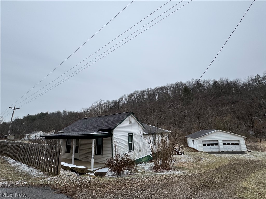 Looking for a farm in the rolling hills of Ohio?  You won't want to miss this opportunity!  Move in ready house, barn and other buildings, plus a bonus house that you may want to restore, or use for storage.  If you like to hunt, there is plenty of property for that, plus it adjoins Wayne National Forest.  The community offers a community building, with lots of activities, plus you are only 10 minutes from the beautiful Ohio River, with lots of fishing, boating and water activities, if desired.  Only 20 minutes away from our county seat with lots of shopping, doctors, etc.. in the heart of beautiful Monroe County!