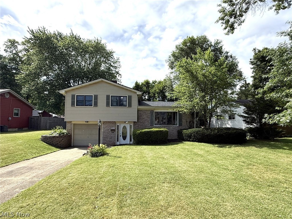 Welcome home to this beautifully updated and move-in ready split-level in Austintown! Offering 3 bedrooms, 1.5 baths, this freshly painted home featuring an inviting open-concept layout designed for comfortable living and effortless entertaining. A mixture of hardwood floors, carpet, solid oak cabinets, vaulted ceilings, oversized bay windows, and abundant natural light create a warm and welcoming atmosphere throughout. The spacious family room and living room provide plenty of room to gather, while the eat-in kitchen comes complete with a range/oven, dishwasher, and refrigerator. Outside, enjoy the fully fenced backyard and attractive brick and vinyl exterior. With a new roof installed in Fall 2025 and a location close to schools, shopping, restaurants, and more, this home is ready for its next owner.