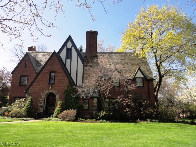 Truly a Masterpiece! Located in Historic Ridgewood, this Home offers grand Arches, Hardwood flooring, unique Ceiling Medallions, ornate Crown Moldings, detailed woodwork. Built in 1928, by John Sherwood Kelly & Arthurs Brothers, this stunning English Tudor Revival, with Brick-paved roads and Street Lighting, has been perfectly preserved. Classic architectural beauty throughout, with much attention to detail. Entry-way with unique Glass door, powder room, & closet. Foyer with hardwood floors. Formal Living rm with hardwood floors, fireplace, Mahogany wood Mantel; French doors lead to English Garden, private Backyard, Patio. Study with built-in bookcase, hardwood floors. Formal Dining rm, hardwood floors, Crown moldings. Remodeled Kitchen, Granite counters, KraftMaid Cabinetry, Stainless-steel appliances, newer floor. Breakfast rm off Kitchen adds charm & warmth. Master Bedroom with full bath, 4 additional Bedrooms, 2 full bathrms, & small office area, all on 2nd level. 3rd level is a fu