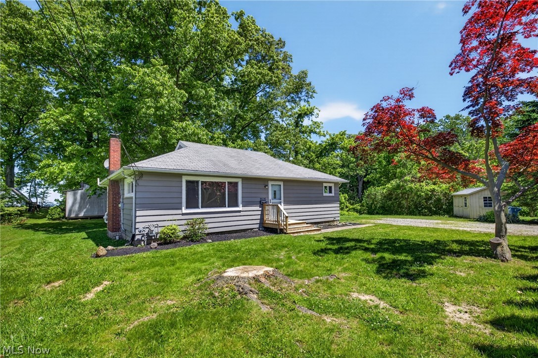 Lake views + peaceful wetlands = your everyday escape!!!
This rare ranch sits on a spacious lot offering privacy, dead end street, nature, and room to grow, all at a fraction of lake view pricing. 2 bed, 2 full baths with a bright living room featuring hardwood floors & fireplace, New windows plus basement windows 2026, freshly painted throughout the home 2026, Furnace and Central Air 2020, Hot Water Tank 2019, Deck and side stairs 2023, shed 2020, radon mitigation installed 2018, nature stone basement floor 2019, Refrigerator 2022, Dishwasher 2019, Front Screen Door 2023. A walkout basement with a second bath is perfect for teen suite, hobbies, or entertaining. Step outside to your private backyard backing up to serene wetlands—no rear neighbors, just nature. Minutes from the beach, parks, and shopping, this home is perfect whether you’re just starting out, downsizing, or looking to expand. Opportunities like this don’t come often with lake views, privacy, and potential all in one. Radon Mitigation in place. Point Of Sale Complient. Photos have been virtually staged