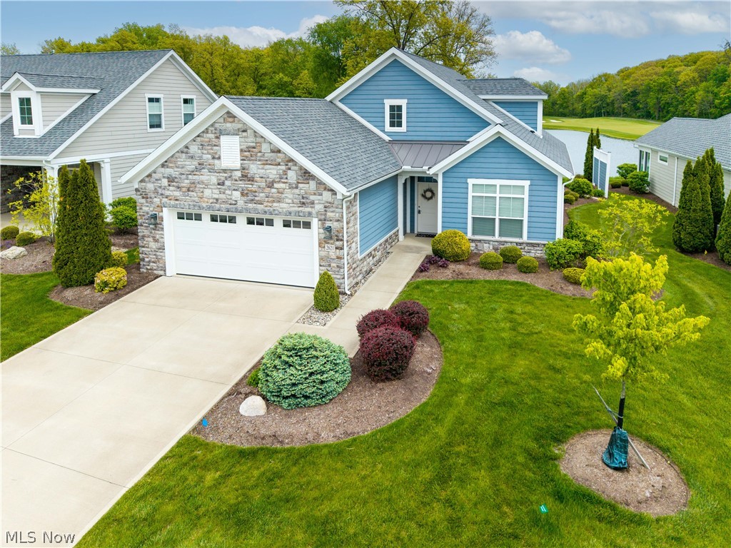 Experience what may be the best golf course view in the area from this exceptional 3 bedroom, 3 bath condo in desirable Fairway Estates. Perfectly positioned overlooking holes 5, 6, and 7 of Catawba Island Club's Arthur Hills-designed golf course, the panoramic scenery also includes a picturesque pond/water feature and an established bald eagle nest visible right from the property. Eagles are frequently seen soaring and hunting the shoreline, while deer and other wildlife add to the peaceful, natural setting.

This very lightly used condo literally smells brand new and shows virtually no wear throughout. The open floor plan was designed to maximize the breathtaking golf course views from most of the first floor, creating an inviting space for both relaxing and entertaining. The spacious primary suite offers direct patio access along with stunning views, while the primary bath features a convenient walk-in shower. A second bedroom and full bath are also located on the main level, with a private third bedroom and full bath upstairs ideal for guests.

Multiple patio areas, both enclosed and open-air, provide versatile outdoor living and entertaining spaces to enjoy sunrise coffee, evening cocktails, or simply the incredible scenery year-round.

Even the oversized 2-car garage feels like new, complete with separate golf cart parking and additional attic storage.

A million-dollar condo with the million-dollar view to match