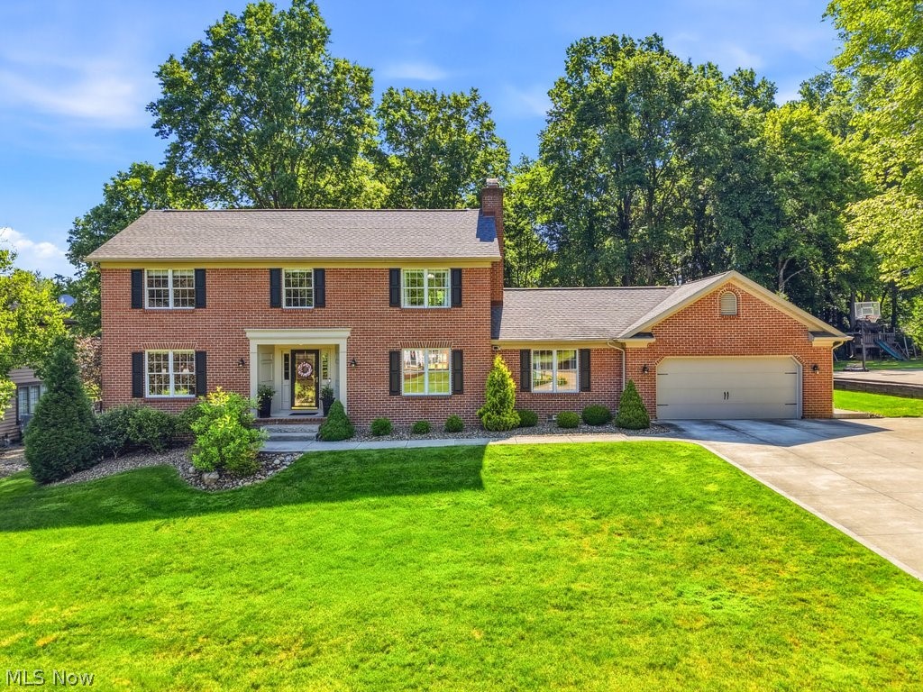 Welcome to this beautifully maintained all-brick home located in Green Local School District. From the moment you step inside, you're greeted by a welcoming foyer with two coat closets, a formal dining room to the right, and a spacious living room to the left. Continue down the hall to the gorgeous kitchen and breakfast nook, featuring granite countertops, stainless steel appliances, and windows overlooking the beautiful backyard. Just off the kitchen, you'll find a convenient half bathroom and a laundry room complete with a large pantry. The kitchen also opens to the inviting family room, showcasing vaulted ceilings, a cozy fireplace, and a sliding glass door leading to the deck. The backyard is perfect for relaxing or entertaining, offering a deck, patio, and gazebo. Upstairs, the second level features four bedrooms and two full bathrooms. Three of the bedrooms offer beautiful hardwood floors, while the spacious primary suite includes vaulted ceilings, a large walk-in closet, and a private bathroom. The partially finished lower level provides additional living space with a rec room, plus an unfinished storage area with built-in shelving. A second laundry hookup is also available in the basement, offering the option for two laundry areas. This home has been lovingly cared for and updated throughout the years. Don't miss your opportunity to make it yours, call today to schedule your private showing!