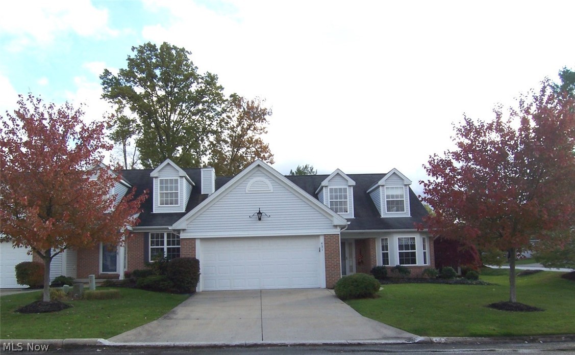 This lovely condo has 3 bedrooms and 2 1/2 baths. The foyer entry, hall, Kitchen and formal dining room have recently been updated with beautiful 3" engineered wood floors. The chandelier in the 2-story foyer has a remote for easy cleaning. The beautiful kitchen is fully applianced and has white cabinets and a pantry/broom closet, as well as a breakfast bar. The formal dining room has a bayed window and will accommodate a dining table and a hutch. The first-floor laundry includes the washer and dryer. The huge great room has a vaulted 2-story ceiling and a gas fireplace. There is a huge master bedroom, on the first floor, with a walk-in closet as well as additional closet storage under the steps. This bedroom has an en-suite bath that includes both a step-in shower and a huge garden tub. Upstairs there are two additional bedrooms, both with double closets, and a full bath! All three bedrooms, the great room, and the sunroom all boast ceiling fans! This wonderful condo has a much sought