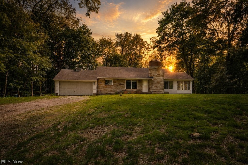 Rare opportunity in the desirable Portage Lakes area! This nearly 7.8-acre property sits directly across from North Reservoir, offering beautiful views and easy public access for fishing, kayaking, and canoeing, plus it’s just minutes from Portage Lakes State Park and public boat launches. The spacious ranch features three first-floor bedrooms with refinished hardwood floors, 1.5 updated baths, and a large living room with rich wood flooring and a cozy wood-burning fireplace. Enjoy nature views from the sunroom and gather in the oversized eat-in kitchen. The super-clean basement offers incredible potential with a rec room, two additional rooms, and a second wood-burning fireplace. Recent updates include a newer gas line from the road, hvac and ductwork, updated electric panel and some wiring, well holding tank, some plumbing, glass block windows, vinyl replacement windows, fresh paint throughout, and a new oven/range. With acreage this rare and reservoir views right out front, this property is ready to become your private Portage Lakes retreat.