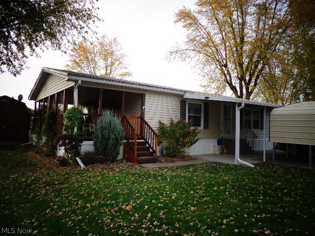 Great home for slowing down or starting up! Nothing to do here! Well maintained, beautiful 3 bedroom, 2 bath home with a covered porch. Current updates include all new doors and windows, a 40-year steel roof, new carpet and a new carport.  Large open living room with fireplace. 10X12 storage shed. 1-Year America's Preferred Home Warranty included.