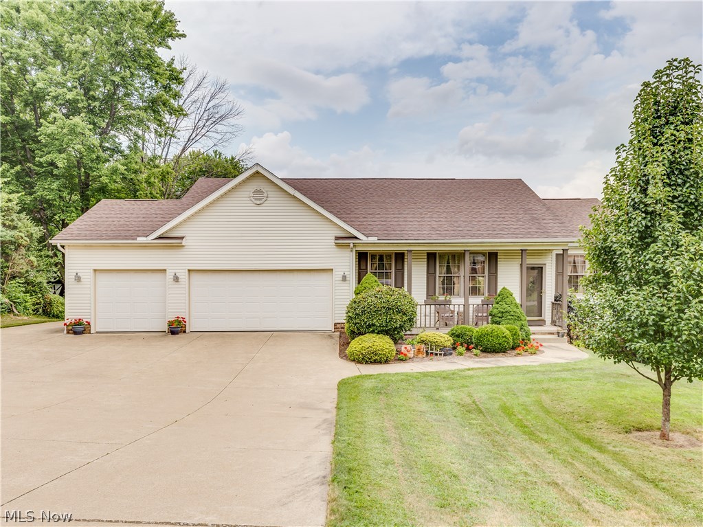 Fantastic 3 bedroom, 3 full bathroom ranch, built in 2001, with a 3 car attached garage and an additional 2 car detached garage. The open floor plan features a great room with cathedral ceiling and gas logs fireplace, a formal dining area, a large kitchen with plenty of cabinet and counter top space, all the appliances, a large pantry, and an eating area, a master bedroom with master bathroom and walk-in closet, 2 more nice sized  bedrooms, another full bathroom and a 1st floor laundry/mud room. The walk out lower level is partially finished and has a rec room with another fireplace and sliding glass door leading to a screened in back porch, a bonus/workout room with carpet, and another full bathroom adding an additional 835 sq. ft. of living space. There is an unfinished side with loads of storage space available. Other features include a high efficiency furnace, A/C, public water, public sewer and a huge cement driveway all on a nice .48 acre lot. This a great home, in a great locati
