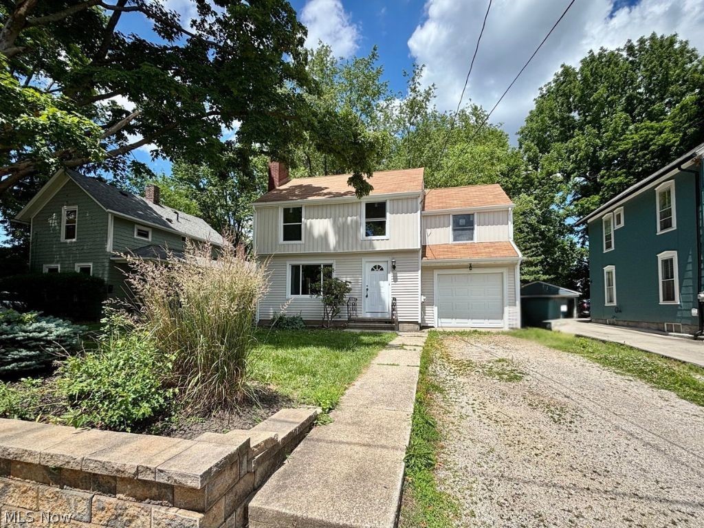 Welcome to this beautifully updated 3-bedroom, 2-full-bath home in the desirable Kent City School District! Conveniently located near downtown Kent and Kent State University, this home offers a blend of modern updates and timeless character. The main level features a welcoming living room with a fireplace, a formal dining room with original built-in cabinets, and a completely renovated kitchen with new cabinetry, granite countertops, and a full stainless steel appliance suite including a dishwasher. Refinished original wood floors and charming woodwork preserve the character of the home while blending seamlessly with the modern updates. Upstairs, you’ll find three generously sized bedrooms and a full bathroom, offering comfortable and functional living space. The finished basement expands the home with a spacious recreation room featuring durable LVP flooring, a second full bathroom, and laundry area. Exterior improvements include new board and batten siding, gutters, garage door, front door, and the majority of windows replaced for improved efficiency and curb appeal. The newer roof provides added peace of mind for the next owner. An attached 1-car garage completes the property. With thoughtful updates, preserved original character, and a convenient location close to shopping, dining, parks, and campus amenities, this move-in ready home is ready for its next chapter. Schedule your private showing today!