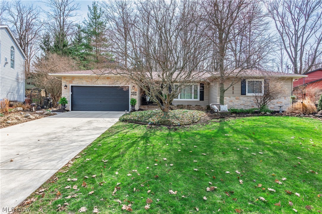 Meticulous Ranch style home in the desired Briar Lake neighborhood is certain to impress. Located at the end of a private cul-de-sac the lot backs up to woods offering gorgeous views all year round. The entire home has been thoughtfully renovated from top to bottom.  The interior has been freshly painted with beautiful hickory hardwood, ceramic and porcelain tile flooring... and custom window treatments throughout.  Warm stone tile finishes compliment many rooms.  Spacious living room.  Gourmet kitchen offers granite counters, stylish backsplash, coffee bar and loads of cabinet / counter space.  Family room with gas fireplace.  Primary bedroom includes "book nook" for reading and totally updated bathroom.  1st floor half bath.  Cozy sunroom with mini-split system for year round comfort. Totally finished basement has been waterproofed with transferrable warranty and offers recreation room, 3rd bedroom or home office with 2 closets, full bath, laundry, hobby and storage rooms.  Attached garage with Nature Stone floor.  Quiet, peaceful backyard offers patio, shed and custom drainage system.  You've found it... a rare combination of natural beauty and refined living.  Call agent today.