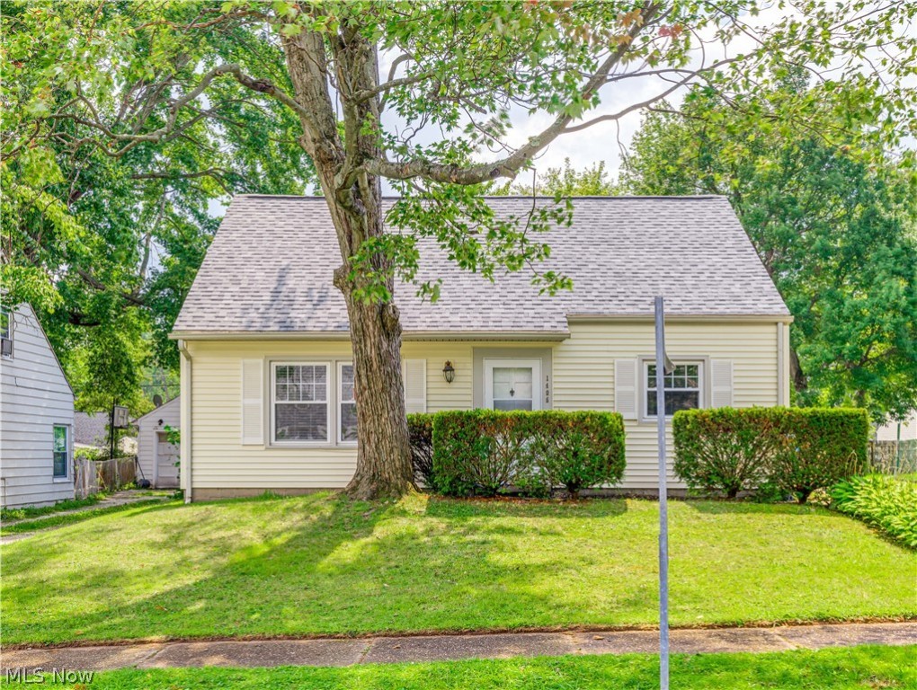 Over 1600 square feet in this competitively priced Cape Cod. Great location and excellent curb appeal is just the beginning of what could be your next home. Featuring a huge addition that boasts a wood burning fireplace and a convenient attached 24' x 24' garage. The kitchen offers lots of countertop space and is open to the Great Room. There is also a formal living-room and two bedrooms on the first floor.  The second floor includes two more nicely sized bedrooms.  You can bring your decorating ideas to make this home your own, but what you will not have to do is add vinyl siding, tub surround and vanity, a roof, insulated garage door, or central air.  Windows have also been replaced at some point.  An expansive deck and extra side lot gives you space for all your outdoor activities.  Take the leap. Invest in your future. Call for a private showing today. (Home is being sold to settle and estate and will be sold as-is.)
