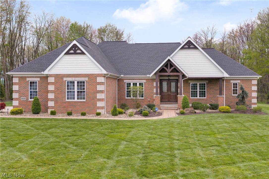 This one-owner, custom-built brick ranch by TriDoc Homes offers a rare opportunity to own a truly upgraded, move-in-ready luxury home. Meticulously maintained & extensively improved, owner has invested hundreds of thousands of dollars in enhancements, making this property truly better than new. Situated on a quiet dead-end street surrounded by million-dollar homes.  From the moment you arrive, the paver-lined concrete driveway & professionally designed landscaping create a striking first impression that reflects the quality found throughout. Side entrance 3 car heated garage w/ access to lower level. Immaculate landscaping leads to covered front porch entrance. Backyard offers unique heated dog/kennel w/ pet friendly fully fenced in pet AstroTurf. Kennel could be used as storage or a he/she shed. Inside feel the warmth of natural cherry wood crown molding throughout. Stunning high end cherry hardwood flooring and 9ft ceilings throughout. Great room has cathedral ceilings w/ full wall stone woodburning fireplace w/ insert and custom mantel. Open concept to chef's gourmet eat in kitchen offering granite counters, Dutchcreek cabinetry, AMAZING double door Frigidaire Professional refrigerator and matching stainless steel appliances. Formal dining area also can be sitting/living room. Master bedroom w/ coffered ceiling & luxury ensuite w/ beautiful porcelain tile, two vanities and custom walk-in shower. Office w/ French doors & closet could be 4th bedroom. 2 additional bedrooms w/ Jack & Jill bath. 1st floor laundry room w/ new washer & dryer. Sliders off of kitchen to new Patio Enclosure w/ heating & cooling. Home features custom remote/cell phone controlled blinds. Full 9ft poured foundation basement w/ 225 amp wiring with Pentair Intellidrive water pressure control center. Minutes to highway access and shopping. Could not build this home today with the improvements for this price and lightly used over the years - truly better than new!