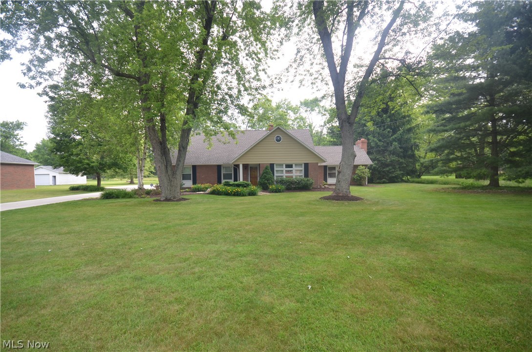 Tallmadge 1 owner home w 6 possible bedrooms, Incredible curb appeal & located on a massive 1.7 acre lot w fantastic privacy & large shed! Concrete driveway with turn around area leads to the big 2 car detached garage w electric and opener. Paver patio out back overlooks the gorgeous back yard. Front door leads to a foyer entry to a large living rm – big enough to include a formal dining area, if desired. The updated kitchen includes raised panel cabinets, beautiful counters, tile backsplash, 2 pantries and an eating area- with easy access to the giant family room w brick woodburning fireplace surrounded by bookshelves and cabinets. Off of the family room find a spacious 3 season sunroom w ceiling fan overlooking the back yard- a fabulous place to sit and relax! The 1st floor includes a spacious laundry room, 3 bedrooms (or space for a home office/hobby room), a nicely updated full bath w tile floor & step in shower & lg vanity. 1st floor master bedroom potential with 1 bedroom offerin