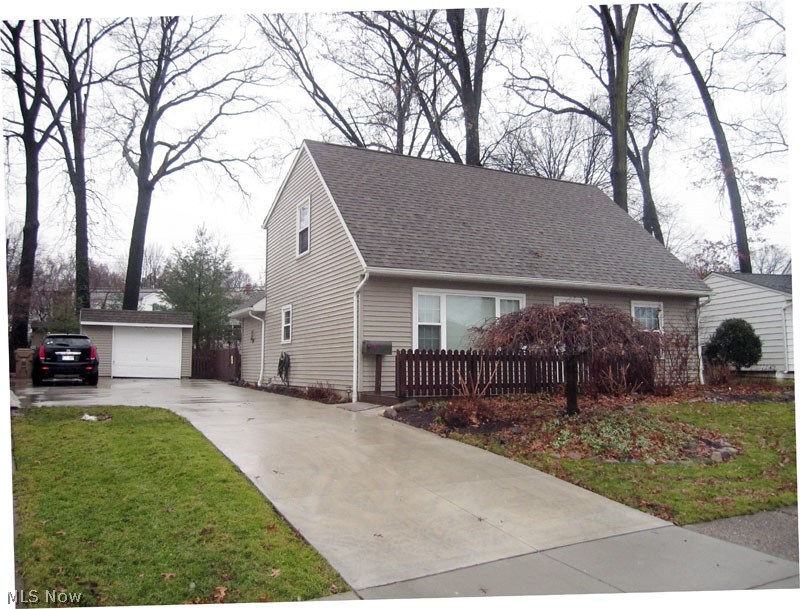 This is virtually a new home.  Completely rebuilt in 2002.  Features 1st floor master and two gorgeous bedrooms on 2nd floor with full bath.  Second floor bedrooms have vaulted ceilings and both baths are beautiful.  Huge kitchen includes all appliances.  Absolutely breathtaking back yard has a park like setting and is completely fenced.  There is a covered bar which is great for seasonal entertaining.  This is a must see home.  Enjoy Cuyahoga Falls utilities & amenities.  Close to schools and major shopping.  Close to Golf Course and City Parks.  Concrete drive in 2015, stamped concrete walk in back yard 6 x 12 2014, kitchen and bath counters in 2014.  All kitchen & bathroom plumbing fixtures new in 2014 (Moen), hardwired surround sound in living room, cable/internet access in enclosed bar area.  Covered grilling station.