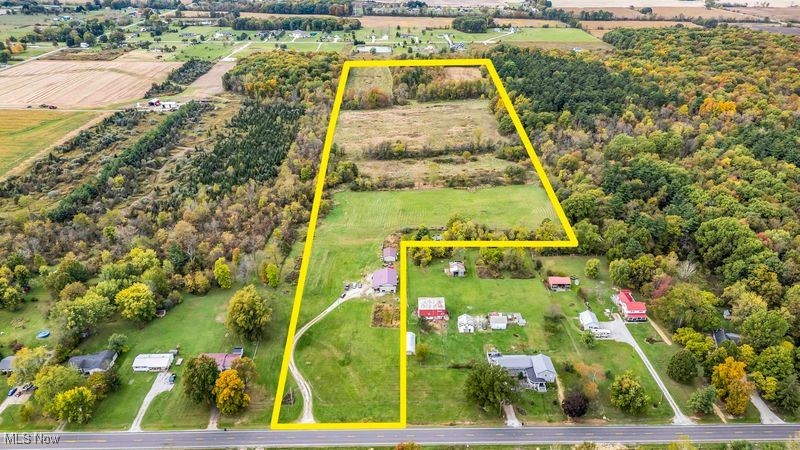 Hunters paradise Across from Findley State Park . North of the Ohio State wildlife Reserve. Excellent opportunity to own a property with a ton of improvements already in place. This property already has a septic system, city water, a driveway, and electricity running to the 44'x56' pole barn. The pole barn features larger sliding doors, a 12' x 32' covered porch, concrete floors, a 1bedroom,1bath, propane wall heater, tankless hot water heater, office with radiant floor heat. enclosed lean-to. An additional 24'x36' 3 sided barn is perfect for extra storage. Looking to build your dream home or transform the existing structure into A Barnd0miniun  some of the improvements already completed, this could be it! As you walk the property you will find a nice mix of open tillable fields and wooded area. The 16 +/- acres tillable ground is perfect for continuing to farm or to turn into pastures .Take the well-managed trails through the property back to a nice small pond that sits on the property . Several small tree lines create natural pitch points ideal for hunting. Multiple open areas also offer potential food plot locations! Thick cover, wooded acreage, food, and water offer a great wildlife habitat. Location is key, as this property also adjoins the Wellington Wildlife Area! Do not miss your chance on this great property!