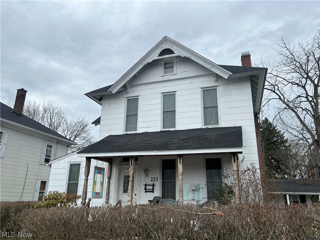 Enjoy old world charm with this lovely home!  Main floor consists of a large living room with decorative fireplace, formal dining room, kitchen plus pantry/kitchen, sunroom and full bath.  the second floor consists of two bedrooms and a full bath.  The third bedroom was converted to a second floor laundry.  New furnace, central air and electric in 2017.  New water and gas lines from the street in 2017.  Main house roof was done in 2025.  Back porch roof done in 2026.Vented glass block windows in the basement.  Property is zoned both residential and commercial, so the possibilities are endless!