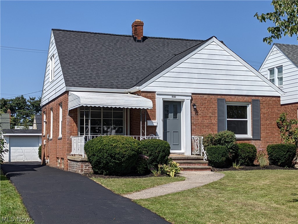 WOW! Checkout this Gem! Fresh updates throughout.  Updates July/August 2021. This brick bungalow is move in ready and has all the cool splashes of updating. Newer laminate flooring in Kitchen, Living Rm and Dining Rm. Newer carpet in ALL bedrooms and upstairs. Newer laminate flooring in back hallway and going down basement steps. Newer kitchen with the "Home and Garden" magazine look...also, includes stainless appliances...refrigerator, range/oven and microwave.  Laundry in lower level includes both washer and dryer. Newer lighting in house and cool bath room w retro look w newer look. 2 bdrms on the 1st floor and 1 bdrm up. Oversized storage attic makes a great place for all the holiday gear or other items. The entire home has been painted on the inside. Spacious covered front porch. 2 car garage. Just sealed blacktop driveway. Nice yard. Central Air.  This home really is a must see!!!