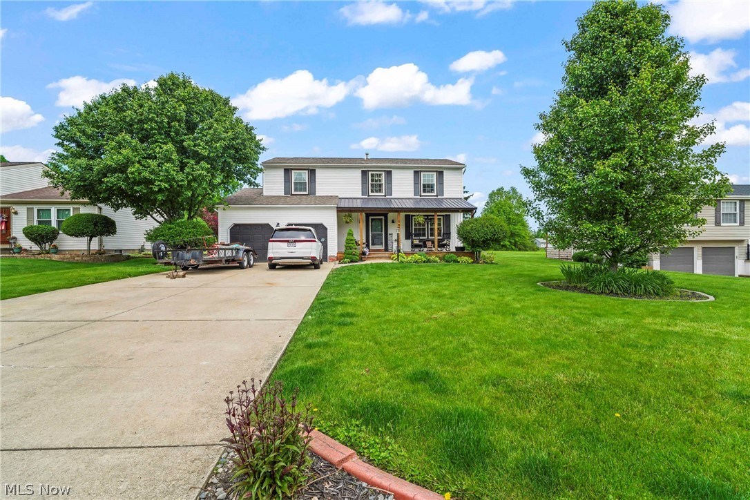 Nestled in a desirable Champion neighborhood, this spacious 4-bedroom, 2.5-bath colonial offers 2,200 square feet of comfortable living space designed for both everyday living and entertaining. This classic two-story home features a welcoming layout with generously sized bedrooms, multiple gathering spaces, and abundant natural light throughout.
The main level offers a functional floor plan with formal dining area, and a beautiful kitchen that flows seamlessly into the large family room—perfect for hosting family and friends. Remodeled in 2023, the large, open kitchen features quartz countertops, an island with bar seating and plenty of cabinet space.  The family room features an electric fire place, ceiling beams and room for plenty of seating. Connected to the family room, but separated by a sliding barn door, is a laundry room / mud room that leads to the outside entertainment area. The backyard features a large deck with a step down to a brick patio - all added in 2024 - which is perfect for summer entertaining and grilling out. The backyard also features a shed, garden and play area for the kids!
Upstairs, the spacious primary features a large walk-in closet. There are three additional bedrooms upstairs which provide flexibility for guests, home offices, or growing families. A full bath in the hall way and in one of the bedrooms completes the upstairs. There is plenty of space in the basement to make into an additional living area and lots of storage. The basement also features a room being used as an office. 
Enjoy the convenience of an attached 2-car garage, additional storage space, and a beautifully maintained exterior with timeless colonial curb appeal. Close to shopping, schools, and the route 82 bypass, this home combines space, comfort, and location in one exceptional package.