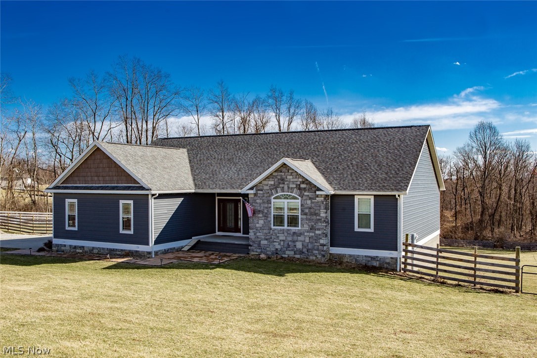 BARNESVILLE!! WELCOME TO 37374 Harry's Ridge! This IMPRESSIVE & IMMACULATE 2015 custom built 4 bed, 3 bath RANCH home with a 2 car attached garage consists of 3296 SF of living space including a MASSIVE full walk out lower level!  It's STONE & VINYL exterior catches your eye in GORGEOUS GRAYTONES... while sitting on 1.85 acres of sprawling countryside views! As you enter into the WIDE FOYER, you feel the warmth of this well appointed layout. On the main level you have 3 SPACIOUS bedrooms, 2 full bathrooms and the custom laundry.  The lower level offers another AMAZING bedroom, a full bathroom and a 46 x 21 ft family room. Laminate, wood, carpet and vinyl floor coverings enhance this home's BEAUTY! While the kitchen features MODERN WHITE CABINETRY, SS appliances, Corian counters and an EAT-AT center island, you also have the option of ENTERTAINING on the 24 x 12 ft rear deck or the concrete patio below! The back yard is completely fenced in and encloses a HUGE storage shed. Convenient t