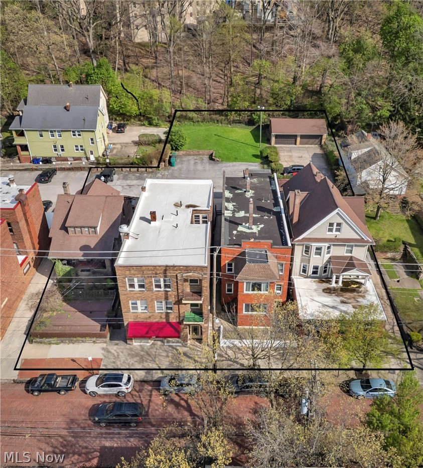 Positioned in the heart of Cleveland’s historic and vibrant Little Italy on Murray Hill. This exceptional investment opportunity features a rare four-property portfolio totaling 14 residential units with 28 bedrooms, along with an operational pizza shop equipped with outdoor dining space, and a unique art gallery space, with half bath. The property is supported by 20 parking spaces, an invaluable amenity in this neighborhood. The portfolio is composed of: a mixed-use building featuring the pizza shop with five 2-bedroom residential units above; an art gallery with three 2-bedroom units; a four-unit multifamily (quadraplex); and a separate duplex. This diverse unit mix provides multiple income streams and long-term upside. Located just steps from University Circle, University Hospitals, Case Western Reserve, the property benefits from strong rental demand driven by proximity to major employment hubs, cultural institutions, and the heart of  Little Italy’s renowned dining and arts scene. Whether you’re seeking a stabilized, income-producing asset or a value-add/development opportunity in one of Cleveland’s most desirable neighborhoods, this is a rare chance to own a cornerstone portfolio in Little Italy.