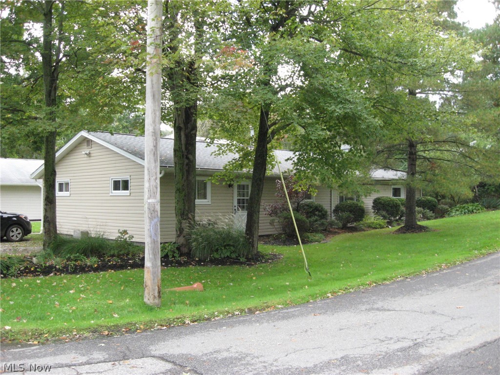Built in 1971 and loads of updates during current owners time include newer: roof, siding, furnace, hot water tank, both bathrooms, kitchen counters, windows, gutters, electrical panel box, entry doors and more.  Wood-burner saves on heating costs.  Two kitchen areas, possible in-law suite.  Kitchen appliances included.  Deck with slider.  Storage shed.  Priced to sell, call today to tour.