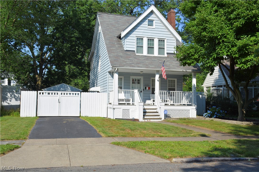 Classic charm meets modern upgrades in this beautiful 3 bedroom colonial near the Cleveland Heights / South Euclid border. Enjoy the warm summer nights on the welcoming front porch. Enter into the spacious living room that boasts a large fireplace with built-in surrounds. The hardwood floors are featured throughout. The Formal dining room includes a window seat with china cabinets perfect for entertaining. The Tuscan inspired eat-in  kitchen is a chef's dream with granite countertops, built in wine fridge, stainless steel appliances and ample storage in cabinets. Enclosed porch upstairs off of third bedroom. The Master bedroom has stairs leading to the walkup attic, perfect bonus space! The privacy fenced backyard features a 1 1/2 car garage and a covered stone patio.