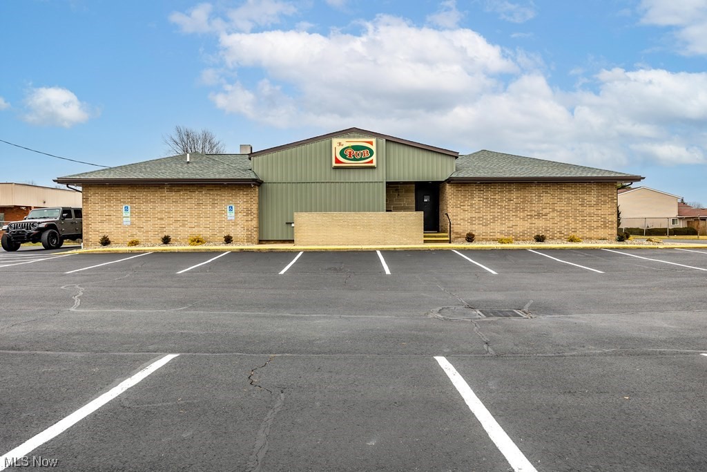 Here is your chance to have your own Bar/Lounge/Restaurant. Ready for a new owner, this stand alone
neighborhood bar, "The Pub" is practically turn key and ready for business. The Roof has been recently replaced and the 80 space parking lot was re done, plus new landscaping. The owner has purchased and updated much of the equipment in the kitchen, including freezers, flat top, broiler and grill. The possibilities are endless with this building, there are 2 handicap accessible ramps, updated bathrooms, and a finished basement with outside access for private parties. "The Pub" was a very popular place and was famous for its Karaoke and dart leagues. The building is in a diverse neighborhood including 2 new developments, multiple condos and hundreds of apartments. This property is FOR SALE ONLY, NO leasing, NO owner financing.