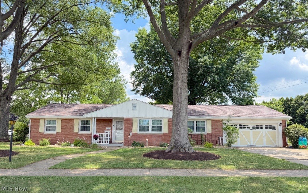 This is a beautifully remodeled brick ranch ideally situated in a highly desirable location near the YMCA and local medical facilities. Offering the ease of one-floor living, this move-in ready home features 4 spacious bedrooms, 2 full baths, a convenient main-floor laundry room, and an attached 2-car attached garage. The thoughtfully designed open-concept floor plan creates an inviting atmosphere. The living room has custom built-in cabinetry and bookshelves, while the bright and airy formal dining room is filled with natural light. The well-equipped kitchen offers a breakfast bar, ample cabinetry, and includes all appliances. The master bedroom serves as a relaxing retreat with a beautifully renovated en-suite bath featuring a walk-in shower. Just off the kitchen is a charming three-season sunroom providing the perfect setting to enjoy your morning coffee or unwind after a long day. The expansive lower level offers endless possibilities and could easily be finished to create additional living space. Additional amenities include a newer gas furnace with central air, a gas hot water tank, 100-amp electric service, and the added convenience of a shower and sink in the basement. Recent improvements include a brand-new roof and new 6-inch gutters, providing peace of mind for years to come. Situated on a level and easy-to-maintain 150x81 corner lot, this exceptional property combines quality updates in a sought-after location.