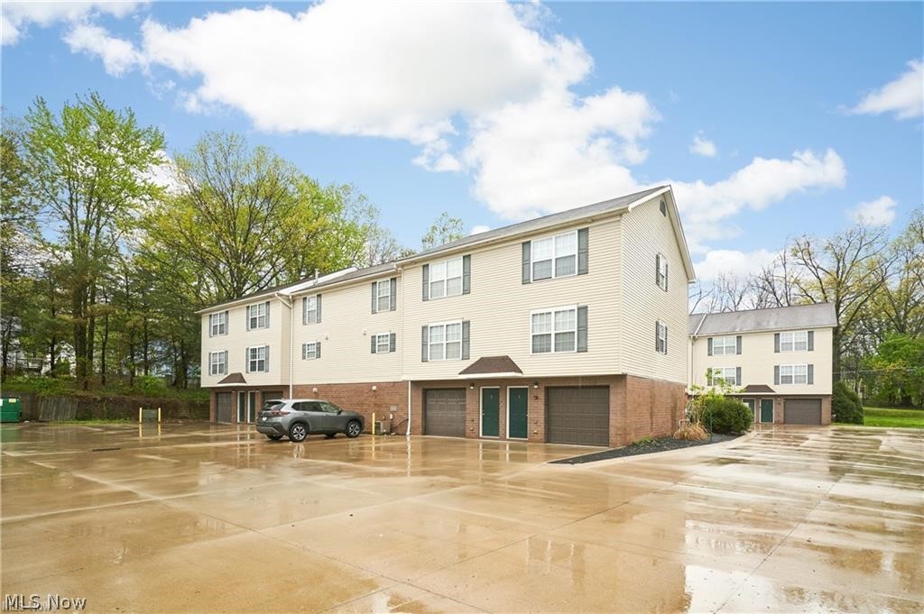 Rare 18 - Unit Townhome-Style Apartment Buildings in the heart of the Cuyahoga Falls. Excellent investment opportunity! This well-positioned 18-unit apartment building offers a highly desirable townhome-style layout, giving each resident the privacy and convenience of their own individual entrance — no shared lobby or interior hallway access needed. Each unit features approx. 1000 sq. ft. with 2 bedrooms, 1.5 baths, a private laundry hookup, and its own attached one-car garage, creating a comfortable and practical living experience that tenants appreciate. Tenants are responsible for their own utilities, helping keep ownership expenses more manageable. Located near a wide variety of shopping, dining, and everyday conveniences, the building is also situated in vibrant Downtown Cuyahoga Falls — a community known for its energy, summer events, entertainment, and welcoming atmosphere. This is a standout opportunity to own a multi-unit property with a layout and amenities that set it apart from traditional apartment buildings. Please see MLS 5212556, 5212566, for additional apartment units for sale.