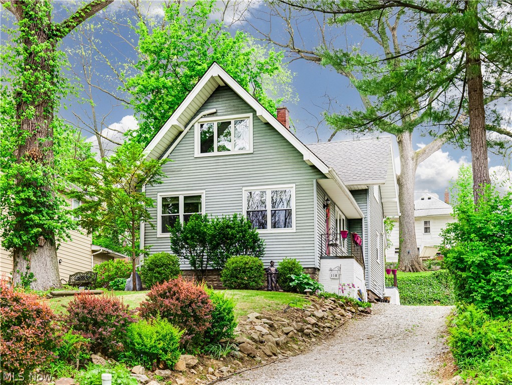 This Gorgeous Cape Cod nestled among the trees is the perfect place to relax and unwind! A large living room with streaming natural light, stone fireplace and original woodwork welcomes you into this spacious main level. The dining room features coffered ceiling, updated wet bar and direct access to the back deck for entertaining. The fully applianced kitchen includes a walk-in pantry and ample cabinet space. Second level boasts 3 bedrooms with original hardwood floors and an updated full bathroom! The outdoor space is like something out of a book with terraced back yard and whimsy landscaping. Call today for a list of notable improvements and to schedule your tour!