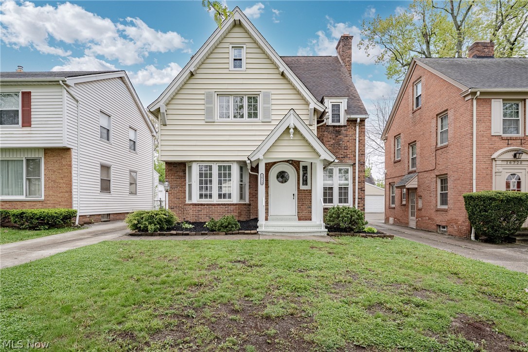 Set in the desirable Lomond neighborhood of Shaker Heights, within the Fernway School district, 16724 Scottsdale Blvd is a charming colonial that blends classic character with thoughtful updates throughout.An arched front door with a leaded-glass oculus window opens into a welcoming foyer that flows into the living room. The living room features an elegant original fireplace, flanked by large wood windows, along with beautiful wood flooring that enhances the space. From here, the home transitions into a formal dining room with a bay window and built-in cabinetry, creating a warm and inviting setting for gatherings. Flooring continues into the kitchen, which offers granite countertops, quality cabinetry, and included appliances. A convenient half bath and mudroom near the back entry complete the main level. Upstairs, the second floor includes three bedrooms, all with hardwood flooring, along with a full bathroom. The finished third floor provides additional living space with a fourth bedroom, a bonus room that could serve as a walk-in closet or flex space, and a second full bathroom. This level offers added versatility and potential additional square footage. The finished basement expands the living area with a recreation room featuring carpeting and a fireplace, along with a bonus room with tile flooring. A utility and laundry area complete the lower level. This home offers a blend of timeless style, updated features, and flexible living space in a sought-after Shaker Heights location.