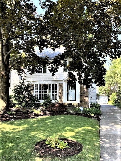 Welcome to Your New Home!! This stately colonial greets you with a warm fireplace, gleaming hardwood floors, impressive cove ceilings and crown molding.  The large bay window in the living room is a cozy niche for relaxing by the fire with a good book, cup of  coffee or a glass of wine. Spacious dining room features a built-in cabinet and opens to the screened in back porch. Brand new luxury vinyl plank flooring showcases the Kitchen, hall, powder room, basement steps and the basement rec room.  You will love cooking in this bright & sunny updated Kitchen! Features include a marble tile backsplash behind the stove, newer appliances, pot rack, cabinets, sink, backsplash & faucet. Check out the pantry cupboard with a tall lazy susan.  Upstairs you’ll appreciate the large bedrooms with a master that opens onto a balcony overlooking the lush backyard.  Bath has been fully updated. There’s also a 3rd floor that can be renovated for another bedroom, office or ‘getaway’ space.  The very clean