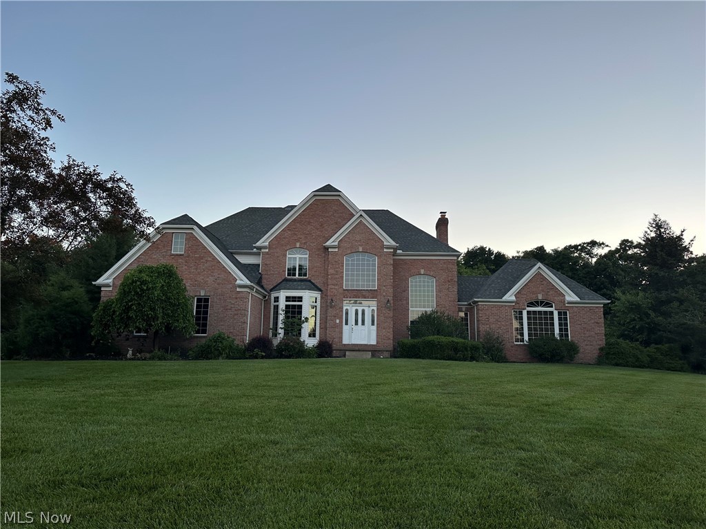 Welcome to this absolutely stunning 5-bedroom, 3.5-bath executive home sitting on a 1.3-acre private lot in the highly sought-after Covington Creek development! From the moment you step into the grand 2-story foyer, the craftsmanship is evident, featuring 6-panel solid hardwood doors, and crown molding. To the right, a beautiful formal living room boasts a dramatic reverse-barrel cathedral ceiling and flows seamlessly into a spacious family room flooded with natural light and offering direct access to a private patio. The heart of the home is the expansive custom kitchen, fully equipped with cherry cabinets, granite countertops, a pantry, and an amazing, oversized island perfect for entertaining and baking. The casual dining nook opens directly onto a large concrete patio, ideal for outdoor gatherings. Open to the kitchen is a spectacular great room featuring a wood-burning fireplace and a convenient wet bar, while a large formal dining room sits just steps away. A main-floor guest bedroom, a full bathroom, and an additional half bath complete the incredibly first level. Upstairs, the second level hosts three generously sized bedrooms with exceptional custom closet space, including two connected by a clever Jack-and-Jill bathroom setup. The luxurious primary suite is a true retreat, offering beautiful views of the private backyard, an impressive walk-in closet, and a spa-like ensuite bath complete with a soaking tub, a custom walk-in tile shower, his-and-hers vanities, and a private water closet. Outside, enjoy your own park-like, wooded paradise featuring two separate concrete patios designed for ultimate relaxation and entertaining. A sprawling 3-car attached garage offers abundant vehicle and extra storage space. Notable mechanical updates include a brand-new hot water tank (2024), HVAC (approx. 10 years), and roof (approx. 13 years). Meticulously designed and beautifully maintained, this dream property blends neighborhood luxury with country privacy!