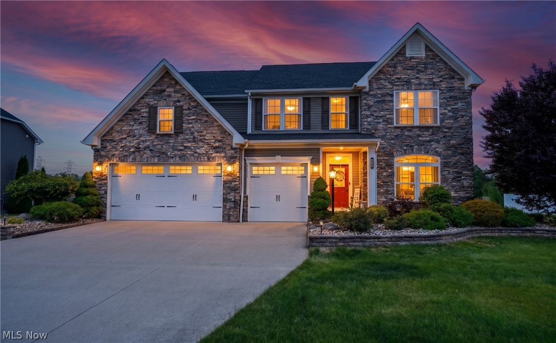 BEST VALUE IN AVON UNDER $750k-EXPANDED SPACE, PREMIUM UPGRADES & RARE FINISHED LOWER LEVEL! In Avondale-10 yrs young-offers exceptional blends of space/style/comfort+efficiency! Privately stocked fishpond behind the home, provides beautiful views/relaxing outdoor lifestyle w/out the maintenance! Striking curb appeal w/stone front facing/spacious 3-car garage! Main level anchored by luxury Hickory hardwood flooring/3-tone upgraded carpeting/9-foot Great Room ceiling/stone fireplace w/custom mantle! Recessed lighting in Living Room+Basement adds to the bright/open feel! The kitchen/Morning Room mirrors extra sq footage in basement! Grand hutch countertop extension into Morning Room creates grand space in Kitchen w/ richly appointed granite counters/island/soft-close drawers/42"Maple cabinets/crown molding/concealed pull-open pantry/kitchen hutch w/backsplash/enhanced lighting/GE built-in double ovens/stainless steel appliances/gas cooktop+exterior-vented exhaust system! Comfort/function continue w/3-tone upgraded carpeting/grand staircase+BONUS ROOM w/ side area-ideal flex space for home office/media room/add'l bedroom! Public record shows 4 bedrooms, but w/the bonus room on 2nd level+extra room on main (w/ a closet ready recess), this can live as 6-Bedroom home! Many high end finishes+polished touches/Sitting Room's coffered ceilings/upper stairwell stone wall facing/wrought iron spiral spindle balusters! Primary suite: dual walk-in closets/private master bathroom w/jetted Jacuzzi tub/granite countertops+a ceramic surround shower! Basement bump-out creates add'l living space-plumbed for future wet bar/potential for a home theater/gym/rec room/guest suite+add'l full bathroom for convenience!! Thoughtfully equipped w/3 levels/3 thermostats/network cables throughout/hard-wired fire alarm system/Adaptable April Air connect/2 sump pumps w/battery backup+an exterior sprinkler system! All backing to privately stocked fishpond maintained by HOA-offering serenity/enjoyment!