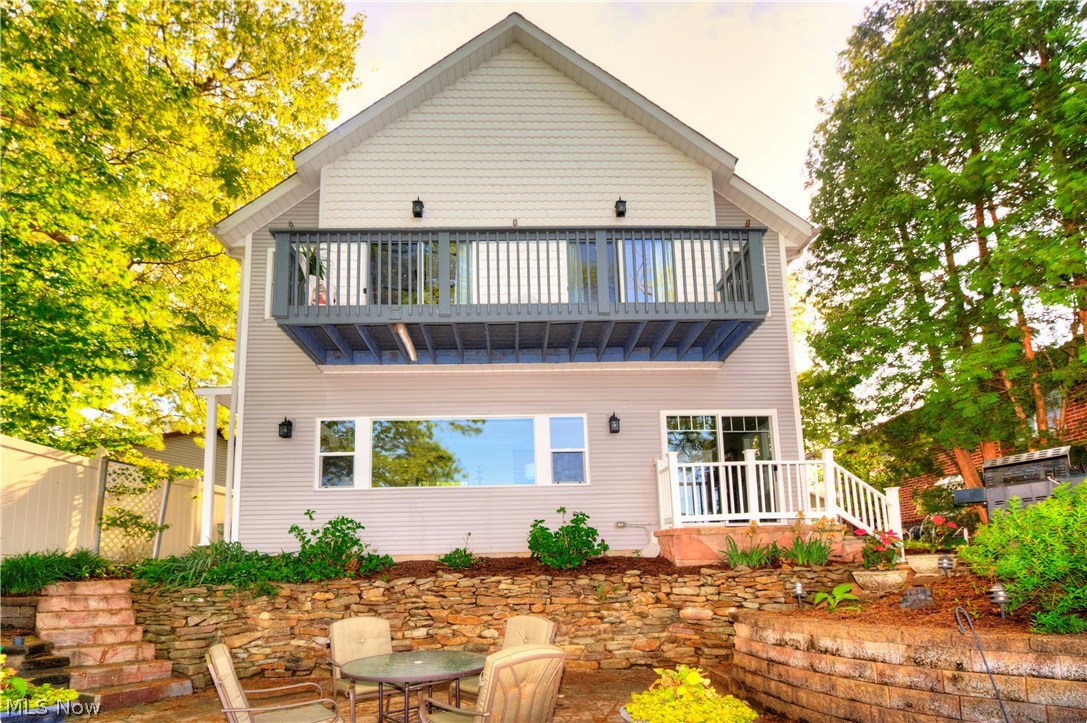Beautifully rebuilt in 2003. This well thought out design has a welcoming open floor plan and many amenities. Potential for single story living with 1st floor master bedroom, master bathroom, kitchen, dining, living room and attached 2 car garage. Enjoy the main lake views from all areas of this home! A second master suite can be found upstairs and has a vaulted ceiling, private master bath, fireplace, his and her closets and private deck. Gorgeous custom kitchen has granite counter tops and the stove/oven that was imported from Italy. Your fantastic yard and the perfect location. Private, fully fenced yard and you own your dock. The dock / boat lift is 26 ft and 20 ft. Water at the end of the dock is 12 feet. Gas grill on your private patio  is plumbed with Natural gas. Do not pass up this custom built opportunity.  This beauty will sell quick! Call today for your private showing