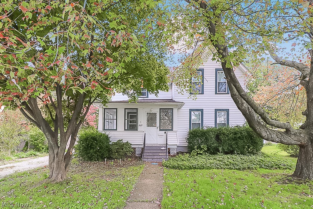 Don't miss out on this beautiful 4 bedroom colonial in the heart of Cuyahoga Falls! Enter through the enclosed front porch to a gorgeous remodeled open concept living and kitchen area complete with updated flooring, high ceilings, and beautiful woodwork. An additional large family room and bonus room with attached half bath, that can be used as the 4th bedroom or additional living space, complete the main level. On the 2nd floor you'll find a large master bedroom with double closets, 2 additional bedrooms, and a beautifully remodeled bathroom. Enjoy the outdoors and wonderful view of your large wooded back yard from the covered deck. With updated HVAC, roof, windows, and flooring there is nothing to do in this home but move right in! Within walking distance to the new Front St and all of the festivities that go along with it. Quick and easy access to the expressway. Don't miss out on this opportunity!