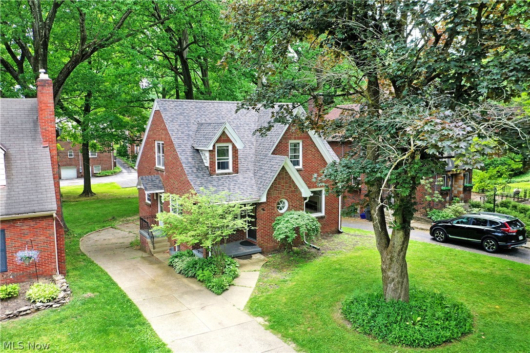 This all brick, 3 bedroom, 2.5 bath home is ready for you! Welcome to 94 Jennette Dr in Newport Glen Historic District! The winding streets of this charming neighborhood lend a feeling of days gone by and make an ideal location for your new home! Step inside and take notice of the redone, original hardwood flooring that flows throughout the home. The living room is perfectly sized for cozy evenings on the couch in front of the fireplace. The formal dining room is just across the entryway and is the perfect spot for fancy dinners or casual bites to eat. Steps away you find the kitchen with updated appliances and tons of cabinet space. A large main floor bedroom and an update powder bath complete the first floor. Upstairs plays host to two additional bedrooms, each with double closets, and an updated full bath! The lower level of this home includes a spacious family room area, laundry services, another full bath and a built in 2 car garage! What are you waiting for? Call today for your personal tour! **Updates: Roof 2024, AC added 2022, Basement LVT 2024, Hardwood Floors Refinished 2022, Upstairs Bath Updated 2022, Half Bath Updated 2022.**