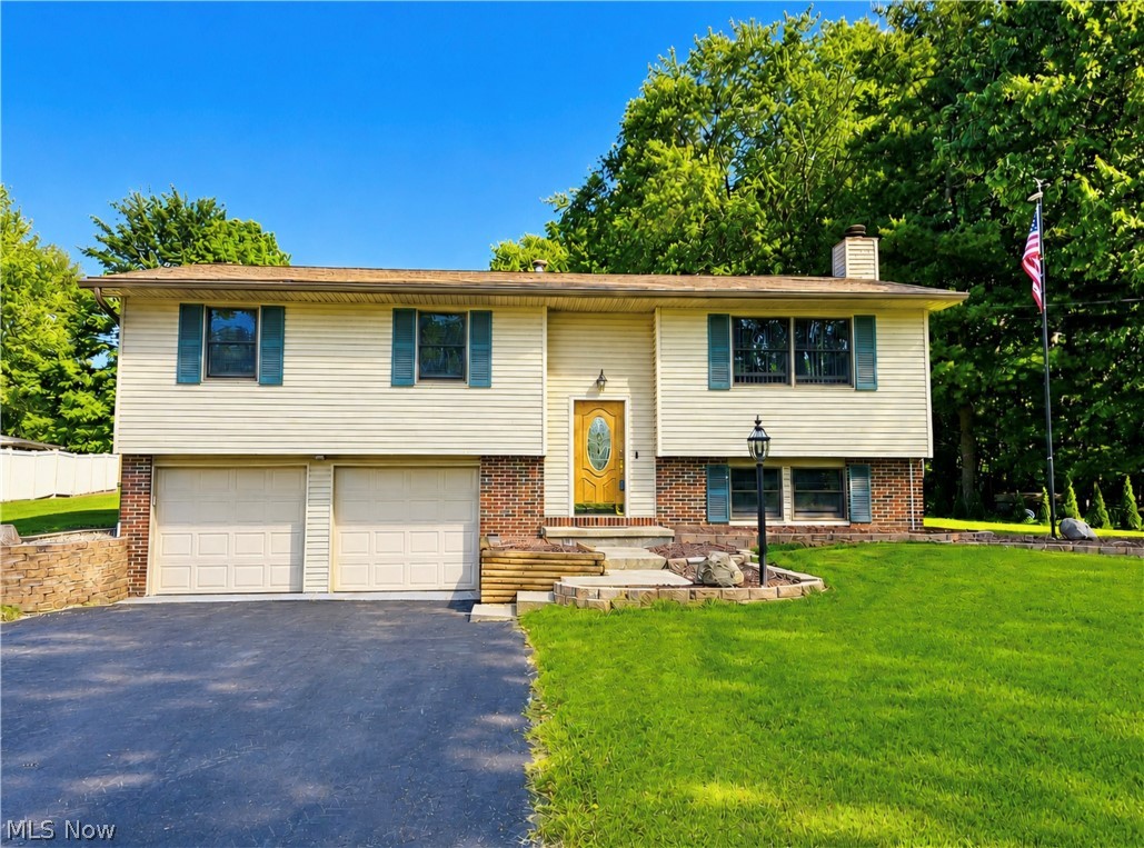 Looking for that "Lake Life" feeling ... well look no further!! Welcome to this beautifully maintained 3-bedroom, 3-bath bi-level home nestled on 1.12 acres in the highly desirable Lakeview School District. Offering 1540 square feet of living space, a heated 2-car attached garage, and just a short walk away from the boat ramp, trails, and public access to Mosquito Lake. The perfect blend of comfort, functionality, and outdoor enjoyment. Step inside to an inviting open floor plan filled with abundant natural light from quality Andersen tilt-in windows. The spacious eat-in kitchen is designed for both everyday living and entertaining, featuring a generous breakfast bar, abundant wood cabinetry, extensive counter space, and recessed lighting. All appliances stay, making this home truly move in ready. Quality craftsmanship is evident throughout the home, highlighted by the solid oak interior doors and closet bifolds, adding character and timeless appeal. The lower-level family room provides additional living space and showcases a stunning stone, wood burning fireplace, creating the perfect setting for cozy evenings. Enjoy outdoor living on the recently stained, multi-level deck, complete with a gas line hookup perfect for grilling and summer days. The expansive yard provides plenty of room for recreation and relaxation, including a basketball hoop. Adding tremendous value and functionality is the fully equipped 2.5 car detached garage. Complete with all utilities, a tankless hot water heater, furnace, bathroom, stove, and refrigerator, this versatile space is ideal for hobbies, workshop use, entertaining space, or additional storage. It also houses the generator system that powers the home, giving added peace of mind. During the fall and winter months, seasonal views of the lake can be enjoyed from the front yard. Whether you're looking for room to spread out, garage space for your projects, or easy access to lake living, this property is ready to welcome you home.