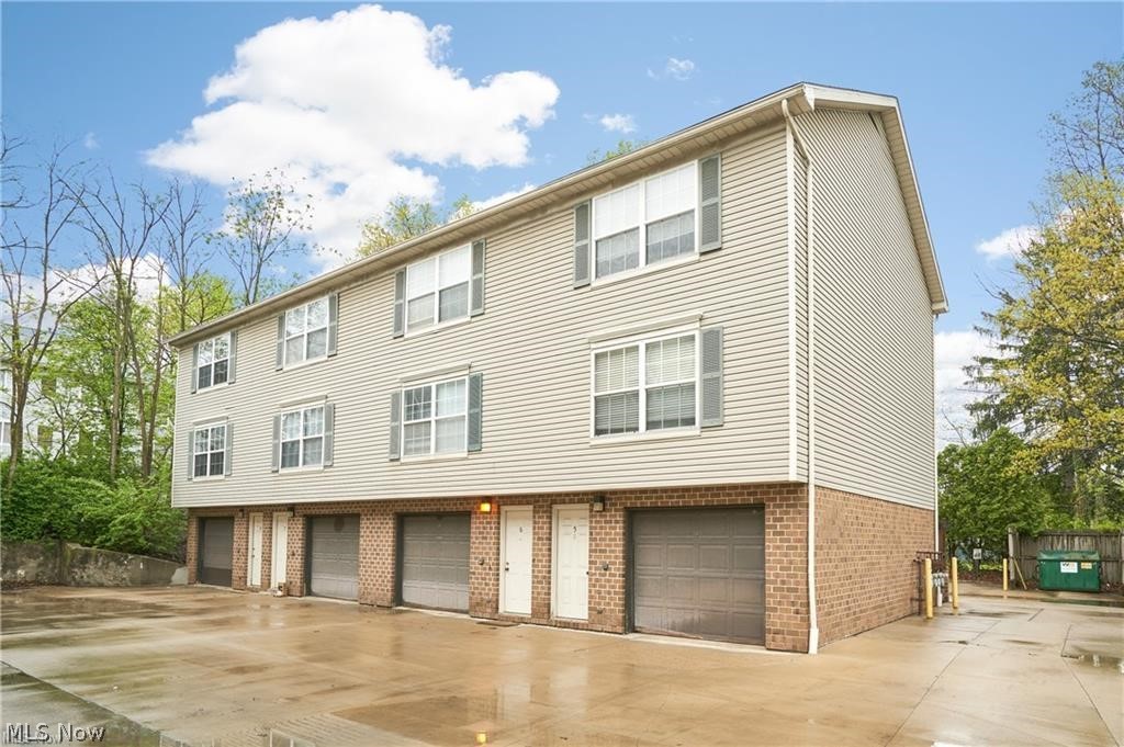 Rare 8-Unit Townhome-Style Apartment Building in Cuyahoga Falls. Excellent investment opportunity! This well-positioned 8-unit apartment building offers a highly desirable townhome-style layout, giving each resident the privacy and convenience of their own individual entrance — no shared lobby or interior hallway access needed. Each unit features approx. 1000 sq. ft. with 2 bedrooms, 1.5 baths, a private laundry hookup, and its own attached one-car garage, creating a comfortable and practical living experience that tenants appreciate. Residents also enjoy balcony space, which is great for relaxing, morning coffee, or unwinding at the end of the day. Tenants are responsible for their own utilities, helping keep ownership expenses more manageable. With only one current vacancy, this property presents strong rental appeal and an opportunity for continued income stability. Located near a wide variety of shopping, dining, and everyday conveniences, the building is also situated in vibrant Cuyahoga Falls — a community known for its energy, summer events, entertainment, and welcoming atmosphere. This is a standout opportunity to own a multi-unit property with a layout and amenities that set it apart from traditional apartment buildings. Please see MLS 5212566, 5212576 for additional apartment units for sale.
