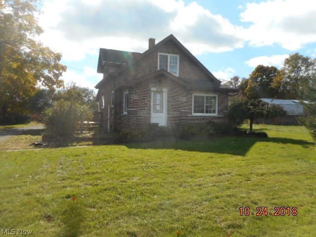 Move in ready 2 bedroom, 1 bath brick home on 1.5 acres.  First floor laundry and bath.  Newer windows, nice wood floors.Full basement and 2 large outbuildings 20x60 and 20x27. Priced "as is" to sell. The well on this property needs to be replaced. This is the reason for the reduction in price