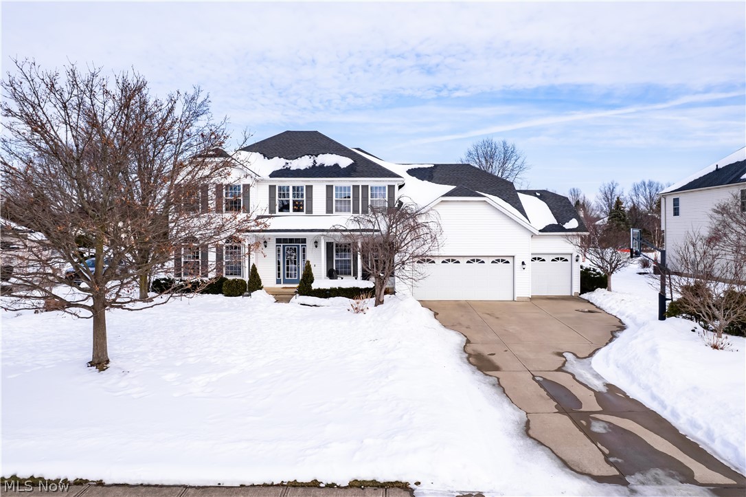 Set on a beautiful ½ acre lot in one of Avon’s most desirable eastern locations, this Summer Hill home offers the ideal combination of location, space, major updates and lifestyle. The 4 bedroom, 3.5 bath has over 3100 sq.ft. plus a 1630 sq.ft. fully finished basement and a three car garage. Step into the bright, two-story foyer where a first floor renovation has created an elevated and seamless feel. Refinished and new hardwood floors flow throughout, featuring coordinating staircase treads that complete the refined look. On one side of the home, the living room has been reimagined into a flexible work space that is ideal for a home office, or homework zone. Across from the living room, the formal dining room connects to the renovated kitchen that includes custom two-tone cabinetry, wood range hood, farmhouse sink, stainless steel appliances, island with built-in microwave, bar area with wine fridge, and huge pantry. The dinette area is filled with natural light from the double patio doors that lead to a spacious deck. Back inside, unwind beside the wood-burning fireplace in the family room that is enhanced with floor-to-ceiling stone veneer and wood mantle. A half bath & laundry room complete the main level. Upstairs, the spacious primary suite offers a private sitting area which is perfect for a yoga space, reading nook, or secondary office. The en-suite bath features dual vanities, a tile shower, Roman tub, linen closet for added storage, and generous walk-in closet. The additional bedrooms are all generously sized with excellent closet space. The finished lower level expands the living space with a wet bar, theater area, and an additional finished room with flexibility for a gym or playroom, along with a full bathroom for added convenience. Outside, the large backyard makes it easy to play, entertain and relax. Major improvements include a newer Carrier furnace, Trane AC, humidifier, tankless hot water tank, irrigation, & complete tear-off roof. Come see today!